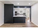 Open-concept layout with a view of the eat-in kitchen featuring a black and white color scheme at 1783 Big Valley Ln, Stone Mountain, GA 30083