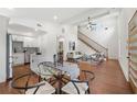 Open concept living space with hardwood floors, modern furnishings, and seamless flow to kitchen at 2822 Waters Sw Rd, Atlanta, GA 30354