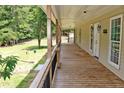 Inviting long front porch, perfect for enjoying the outdoors at 3129 Etchison Rd, Loganville, GA 30052