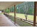 View from the porch, featuring wood flooring and backyard views at 3129 Etchison Rd, Loganville, GA 30052
