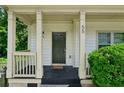 Inviting covered front porch with columns and dark front door at 55 Bowen Ave, Atlanta, GA 30315