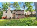 A spacious backyard perfect for outdoor activities, featuring a grassy lawn and privacy fencing at 134 Timber Creek Sw Ln, Marietta, GA 30060