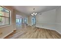 Bright dining room with updated flooring and neutral paint, ready for your personal touch at 1704 Yarborough Dr, Peachtree City, GA 30269