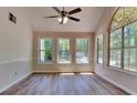 Sun-drenched living room with plenty of windows and modern flooring at 1704 Yarborough Dr, Peachtree City, GA 30269
