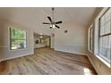 Inviting living room with ample natural light and views into the kitchen at 1704 Yarborough Dr, Peachtree City, GA 30269