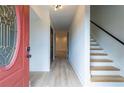 Inviting entryway with hardwood floors and staircase at 2859 Spring Villa Se Ln, Smyrna, GA 30080