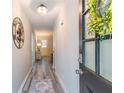 Welcoming foyer with wood-look flooring, a decorative mirror, and a view of the bright interior at 2038 Summertown Dr, Norcross, GA 30071