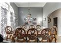 Formal dining room showcasing a large dining table, decorative chandelier, and elegant decor at 1258 Rocky Branch Trl, Lawrenceville, GA 30043