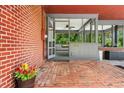Covered brick patio featuring an outdoor seating area, ideal for entertaining guests or enjoying quiet moments at 1630 Park Ln, Marietta, GA 30066