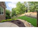 The backyard features mature trees and lush landscaping at 1745 Habersham Marina Rd, Cumming, GA 30041