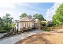 Beautiful exterior view of the home, showcasing its well-maintained yard and mature trees at 1745 Habersham Marina Rd, Cumming, GA 30041