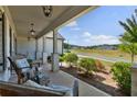 Inviting front porch with seating and scenic neighborhood views at 203 Belmont Park Dr, Canton, GA 30115