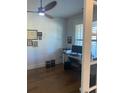 Bright office space with a ceiling fan, natural light, and a dedicated work area at 203 Belmont Park Dr, Canton, GA 30115