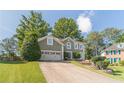 Charming two-story home featuring a well-manicured lawn, two-car garage, and a welcoming front entrance at 3830 Gallant Fox Ct, Duluth, GA 30096