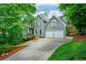 Charming two-story traditional home with landscaped front yard and a two-car garage at 265 Landfall Rd, Atlanta, GA 30328