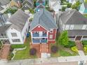 Aerial view of a red two story home in a neighborhood, showcasing the well maintained yard at 121 Fulton Se Way, Atlanta, GA 30312
