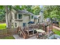 Expansive backyard with multi-level decks, a patio, and fenced yard at 2666 Peachtree Walk, Duluth, GA 30096