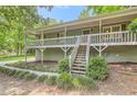 Beautiful home with a large front porch and well-maintained landscaping, perfect for enjoying the outdoors at 62 Sweetwater Pkwy, Powder Springs, GA 30127