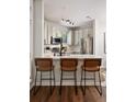 Kitchen with stainless steel appliances, a breakfast bar, and modern track lighting at 821 Ralph Mcgill Ne Blvd # 2219, Atlanta, GA 30306