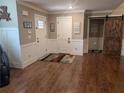 Inviting entryway with rich hardwood floors and decorative accents, welcomes you into the home at 212 Wilshire Ter, White, GA 30184