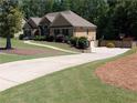 Lovely home boasts a long driveway and a basketball hoop, perfect for Gathering fun at 212 Wilshire Ter, White, GA 30184