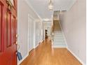 Inviting home foyer featuring hardwood floors, stairs to the upper level, and a bright, neutral palette at 2260 Burlington Ln, Snellville, GA 30078