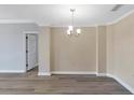 Bright dining room with luxury vinyl plank flooring and neutral wall colors at 3475 Oak Valley Ne Rd # 1930, Atlanta, GA 30326
