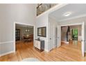 Spacious foyer with hardwood floors, staircase, and views into multiple living areas at 3638 Sope Creek Farm Se, Marietta, GA 30067