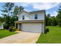 Charming two-story home with lush green lawn featuring a two-car garage and plenty of parking at 20 Sloane Ct, Covington, GA 30016