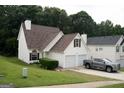 Charming home with a two-car garage and well-manicured lawn at 3269 N Winds N Trl, Douglasville, GA 30135
