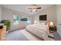 Bright and spacious main bedroom features vaulted ceilings, a comfortable bed, and serene decor at 765 Martin Rd, Stone Mountain, GA 30088