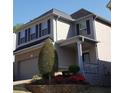 Lovely two-story home with brick and siding, showcasing well-maintained landscaping at 3179 Woodward Down Trl, Buford, GA 30519