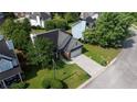 An aerial view showcasing the home's architecture, surrounding landscape, and well-maintained lawn at 2163 Berryhill Se Cir, Smyrna, GA 30082