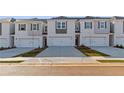 Stylish townhomes with individual garages and well-maintained landscaping, close to neighborhood amenities at 341 Heavenly Hollow Pl, Mcdonough, GA 30253