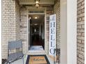 Welcoming entryway with a stone surround, 'Welcome' mat, and open view to the home interior at 3748 Spring Place Ct, Loganville, GA 30052