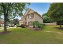 Beautifully landscaped front yard of a two-story home with a well-maintained lawn at 2747 Harper Woods Dr, Marietta, GA 30062