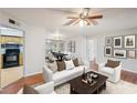 Cozy living room featuring a dining area, hardwood floors, and natural light at 514 Mcgill Ne Pl, Atlanta, GA 30312