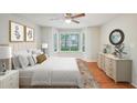 Bedroom with bay window, hardwood floors, neutral colors, and ample natural light at 514 Mcgill Ne Pl, Atlanta, GA 30312
