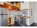 A modern kitchen featuring stainless steel appliances, stainless steel backsplash and butcher block countertops at 878 Ne Peachtree Ne St # 326, Atlanta, GA 30309