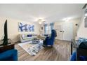 Comfortable living area with hardwood floors, modern decor, and plenty of natural light at 1320 Revelstoke Cv, Riverdale, GA 30296