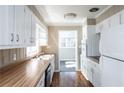 Functional kitchen with white cabinets, wood countertops, and modern appliances, providing plenty of storage space at 6332 N Hampton N Dr, Atlanta, GA 30328