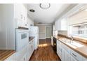 Functional kitchen with white cabinets, wood countertops, and modern appliances, offering a practical cooking space at 6332 N Hampton N Dr, Atlanta, GA 30328