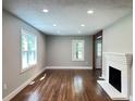 Inviting living room with fireplace, freshly painted and natural light creating a warm and inviting space at 6538 N Sweetwater Rd, Lithia Springs, GA 30122