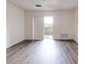 Bright living space with wood flooring and a sliding glass door to the balcony at 300 Johnson Ferry Ne Rd # B604, Atlanta, GA 30328