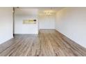 Open concept living space featuring wood flooring and views of the kitchen at 300 Johnson Ferry Ne Rd # B604, Atlanta, GA 30328
