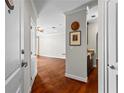 Welcoming entryway with hardwood floors that lead into a living area and kitchen bar at 325 E Paces Ferry Ne Rd # 703, Atlanta, GA 30305
