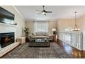 Inviting living room with a fireplace, hardwood floors, and neutral color palette at 1087 Berkley Se Dr, Smyrna, GA 30082