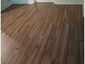 Close up of damaged wood laminate flooring at 2463 Stone Rd, East Point, GA 30344