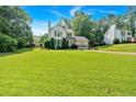 Spacious front lawn with a charming home, offering a two-car garage and a peaceful atmosphere, enveloped by lush greenery at 285 Sw Martin Sw Way, Marietta, GA 30064