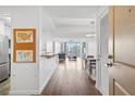 Bright living room showcasing hardwood floors, modern lighting, and a seamless flow to outdoor city views at 3338 Peachtree Rd # 2005, Atlanta, GA 30326